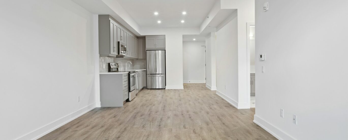 brown wooden parquet floor and white wall